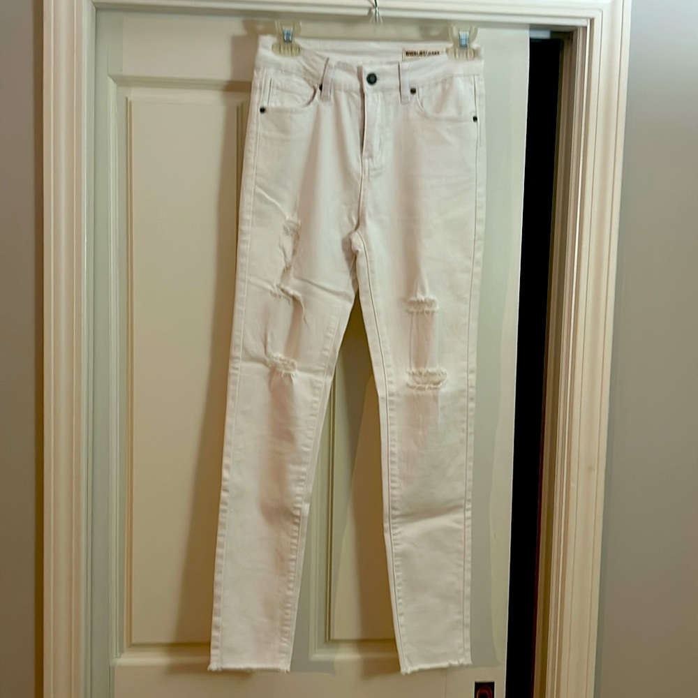 Distressed skinny white jeans.
